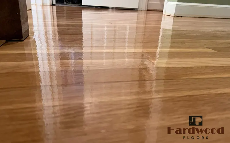 Ultra-reflective high-gloss finish on a newly completed natural oak strip floor by JP Hardwood Flooring.
